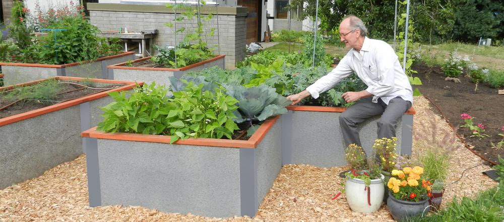 man tending to his raised garden beds in grey color